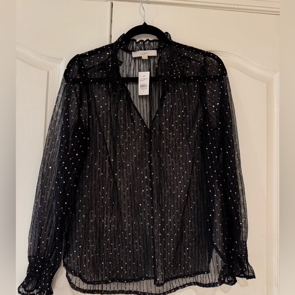Black and gold Loft blouse 
No lining. Not worn tags intact
Size M
